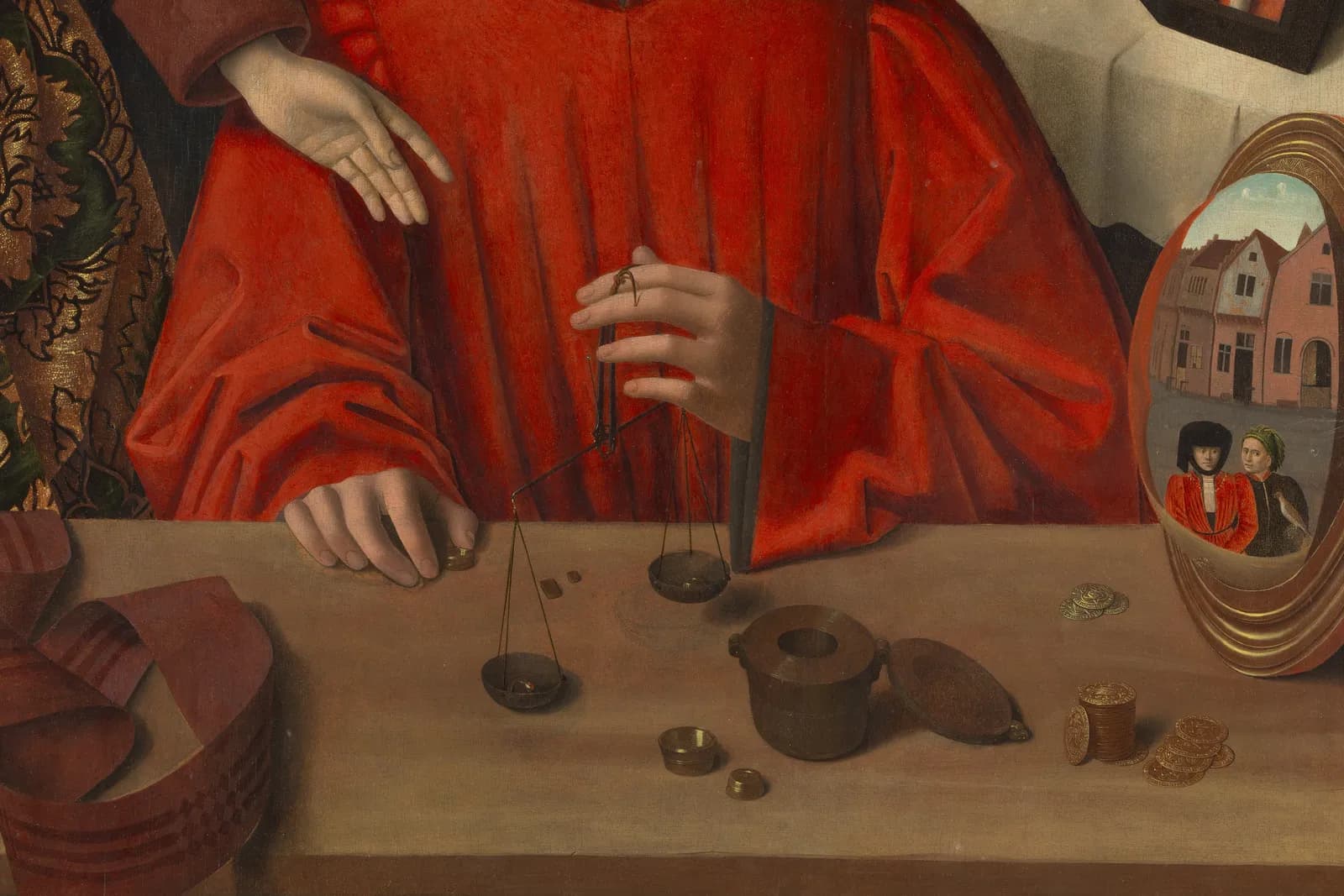 Detail of A Goldsmith in His Shop by Petrus Christus: a goldsmith weighing a ring on a scale at his counter.